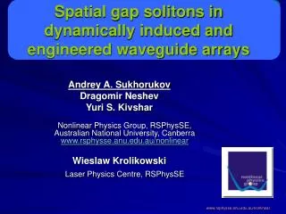 Spatial gap solitons in dynamically induced and engineered waveguide arrays